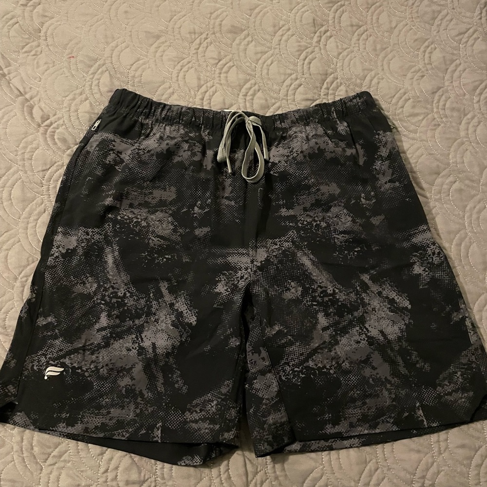 Fabletics 7” gym shorts with liner. New, never worn, no tags.